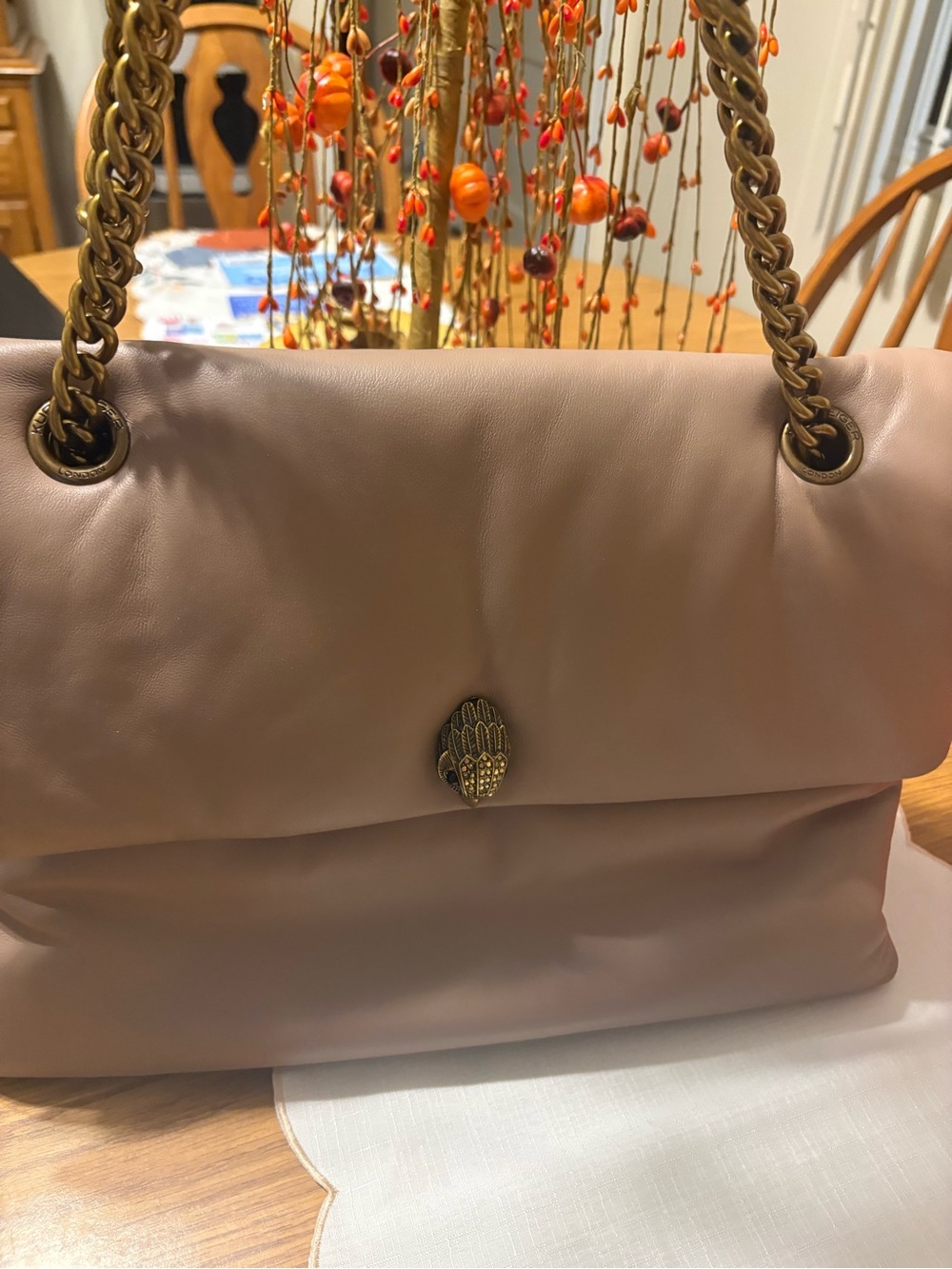 Kurt Geiger dusky tan leather shoulder bag with gold chain and emblem